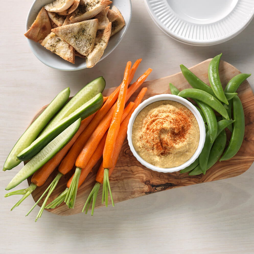  Classic Hummus in bowl on platter with cut veggies recipe made with ReaLemon 